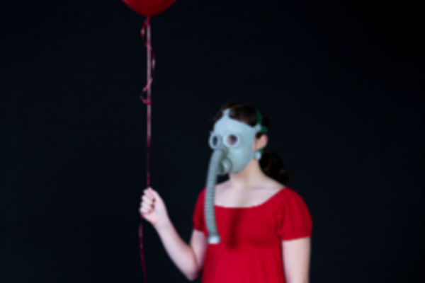 contagion cabaret woman in red dress with gas mask and balloon